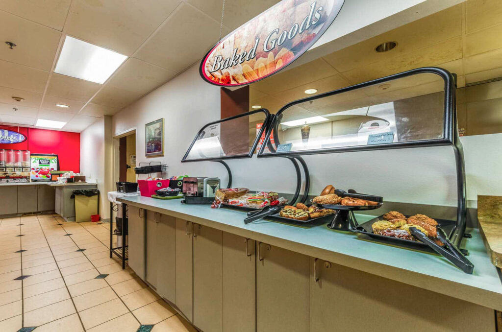 Cafeteria style food bar with baked goods