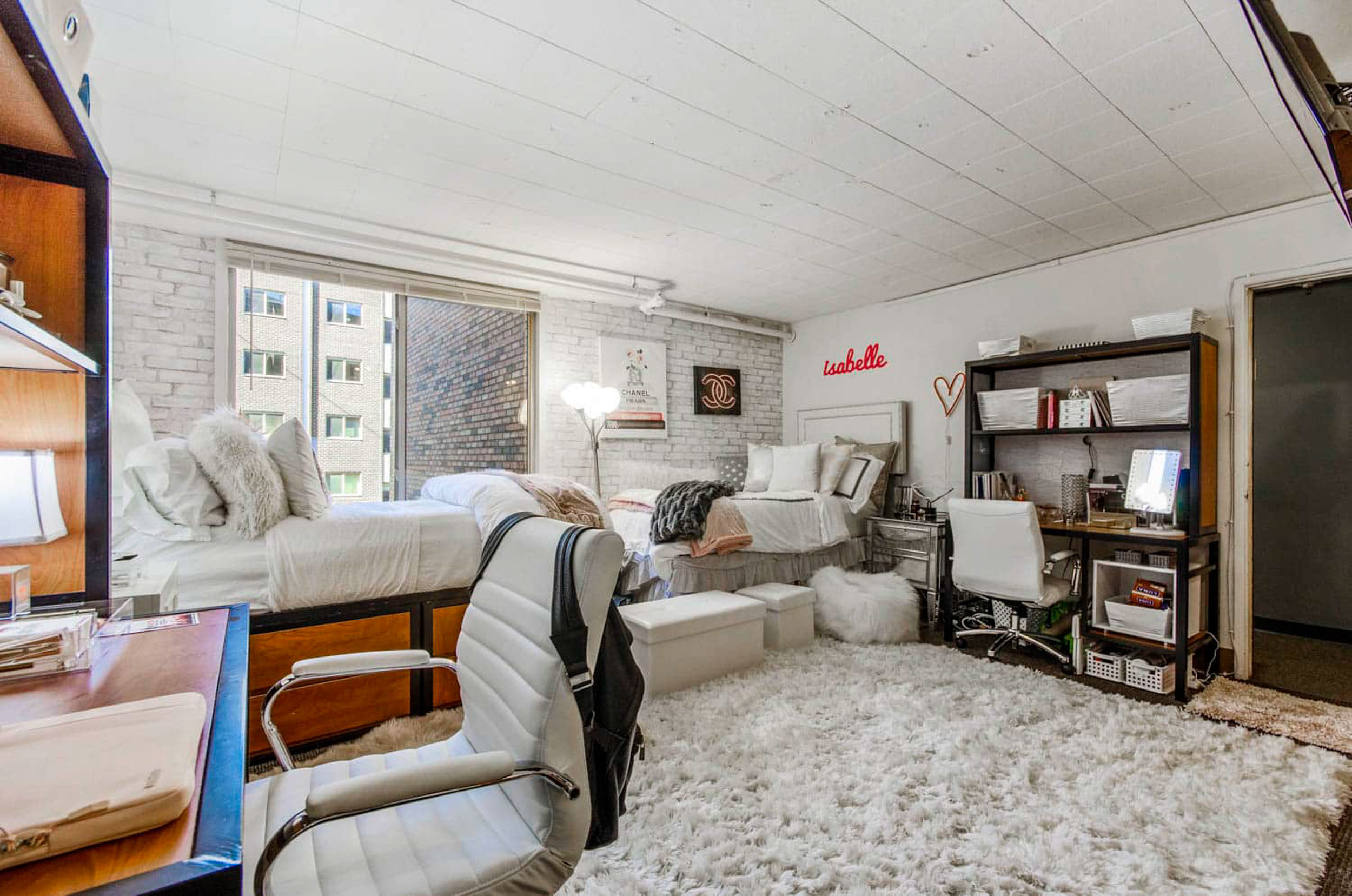Cozy decorated student dorm room with twin beds and desks
